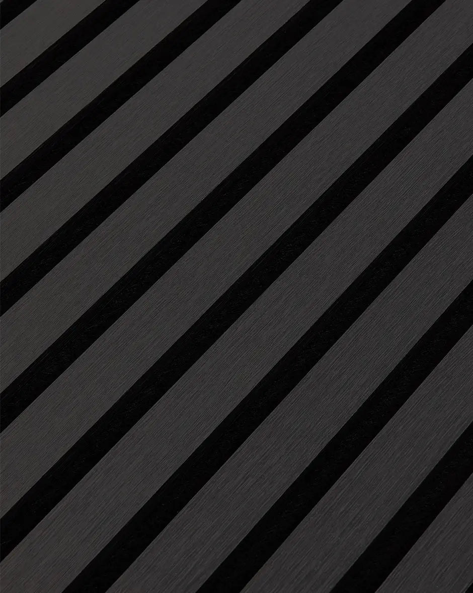 Close-up of the black woodgrain finish and vertical slat texture on NORDAN acoustic wall panels.