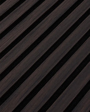 Close-up of the dark walnut woodgrain finish and vertical slat texture on NORDAN acoustic wall panels.