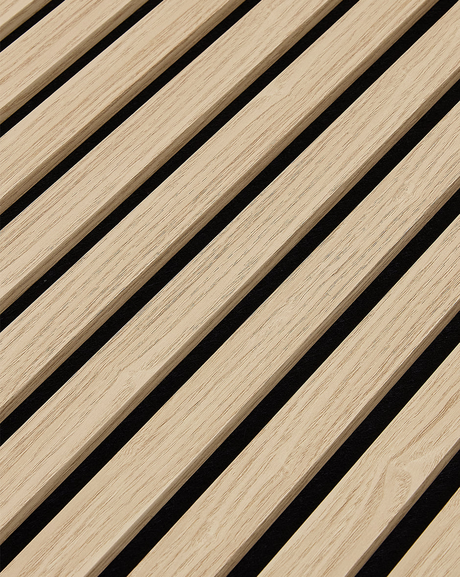 Close-up of the oak woodgrain finish and vertical slat texture on NORDAN acoustic wall panels.