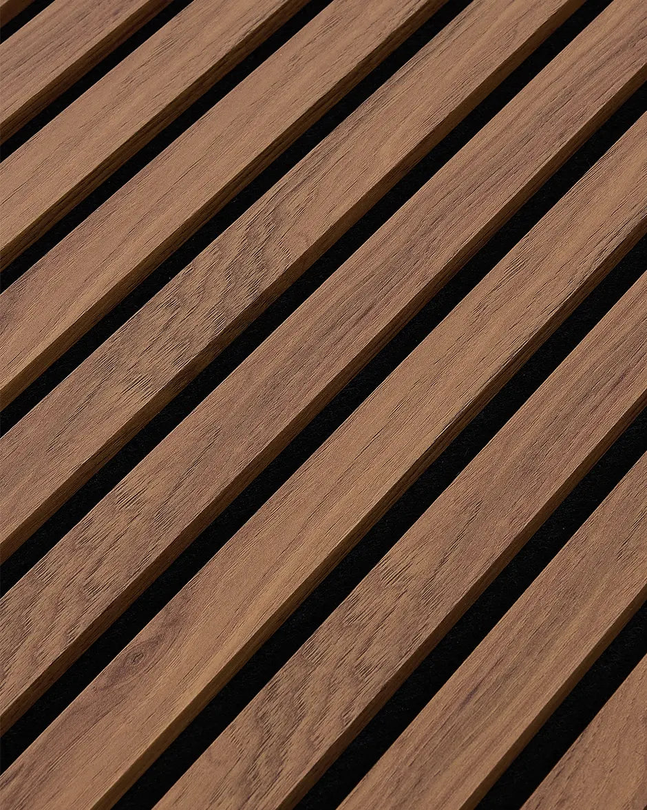 Close-up of the teak woodgrain finish and vertical slat texture on NORDAN acoustic wall panels.